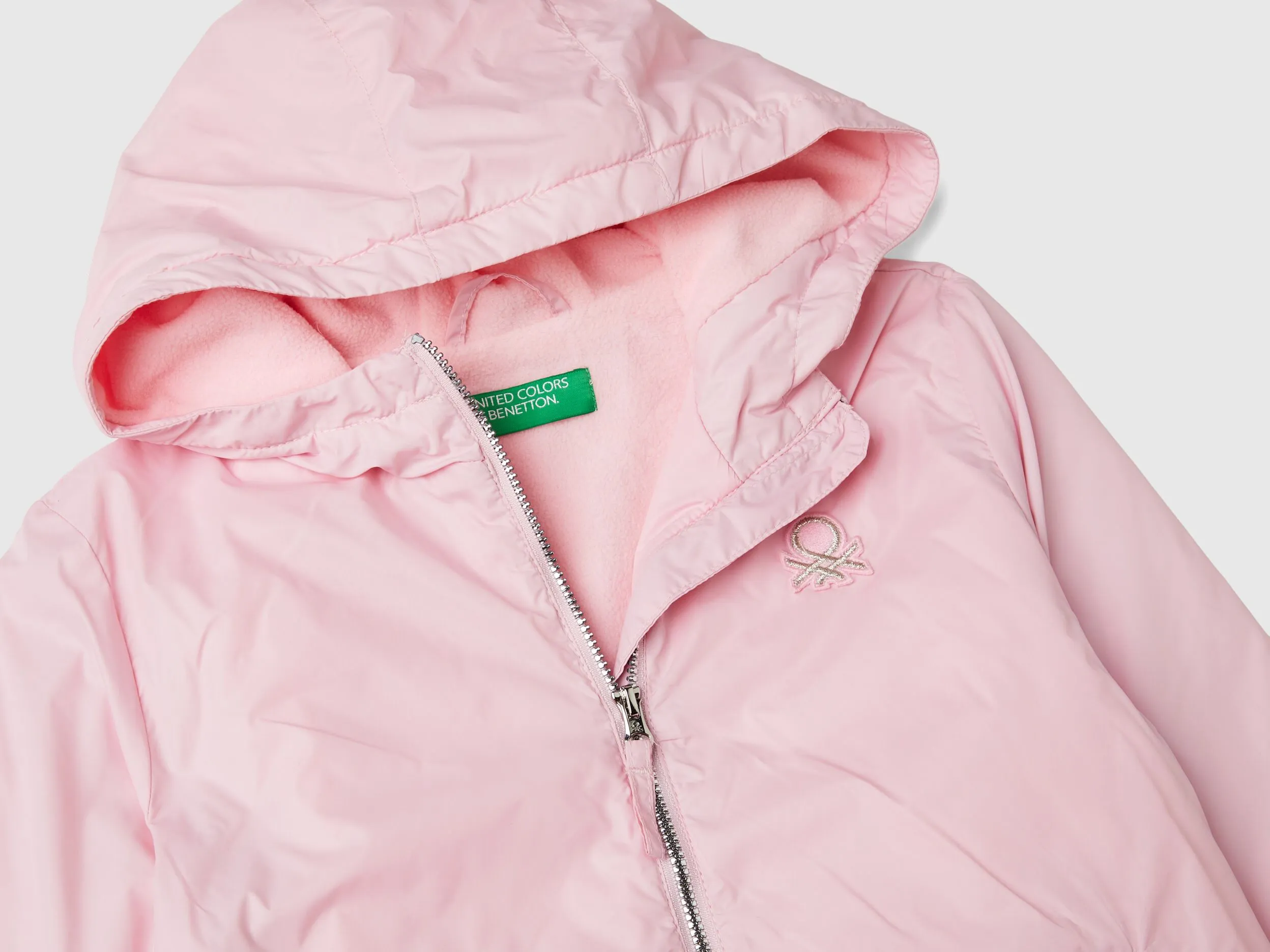 Glossy jacket with zip and hood - Pink | Benetton