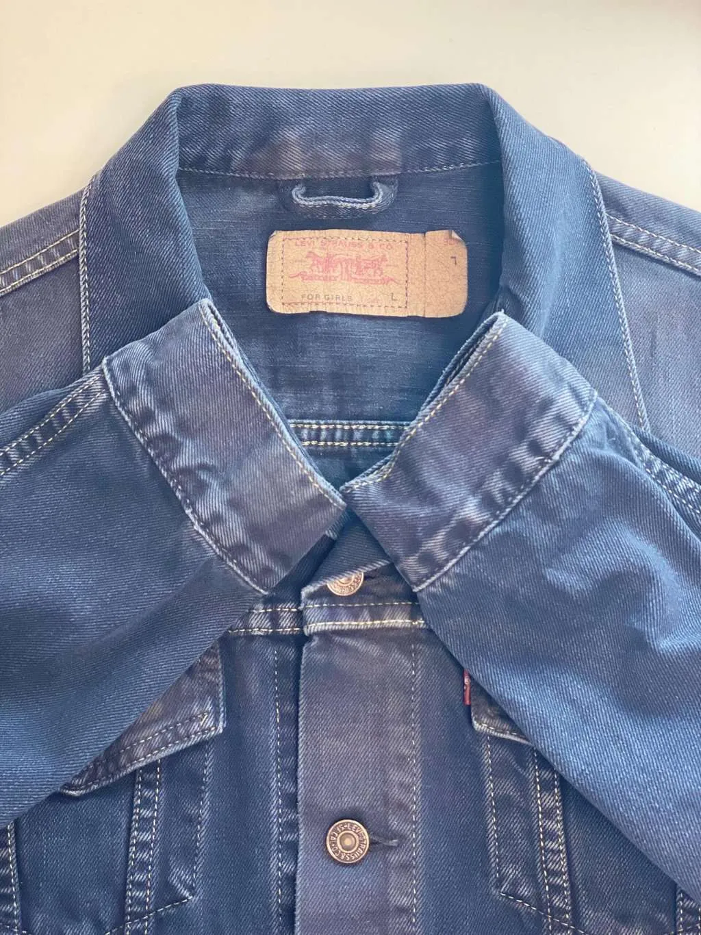 Vintage Levis women’s denim jacket in navy, overdyed – Medium